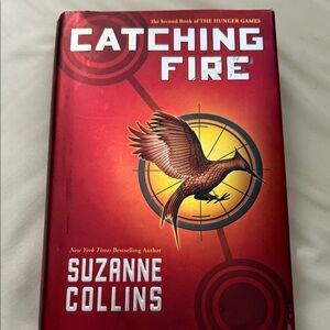 Catching Fire by Suzanne Collins - Red Hardcover